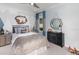 Cozy bedroom with mountain-themed wall decor and ample storage at 1212 Teal Creek Dr, St Cloud, FL 34769