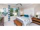 Guest bedroom featuring a comfortable bed and window with curtains at 1212 Teal Creek Dr, St Cloud, FL 34769