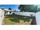 Private backyard with a grassy area and white vinyl fence at 12162 Graduate Dr, Orlando, FL 32826