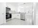 Modern kitchen featuring stainless steel appliances and granite countertops at 12162 Graduate Dr, Orlando, FL 32826