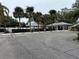 Community parking lot with ample spaces near clubhouse at 12162 Graduate Dr, Orlando, FL 32826