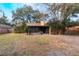 Spacious backyard with screened porch and mature trees at 1309 Paradise Ln, Winter Park, FL 32792