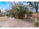 Large backyard with screened patio and wooden fence at 1309 Paradise Ln, Winter Park, FL 32792