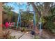Relaxing backyard patio with seating and lush plants at 1309 Paradise Ln, Winter Park, FL 32792
