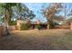 House backyard view with large yard and wooden fence at 1309 Paradise Ln, Winter Park, FL 32792