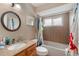 Bathroom with tub, shower, granite countertop, and window at 1309 Paradise Ln, Winter Park, FL 32792