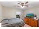 Comfortable bedroom with a double bed, dresser, and ceiling fan at 1309 Paradise Ln, Winter Park, FL 32792