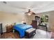 Bedroom with a double bed, wooden dresser, and large window at 1309 Paradise Ln, Winter Park, FL 32792