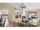 Bright living room with fireplace,tile flooring and view to kitchen and backyard at 1309 Paradise Ln, Winter Park, FL 32792
