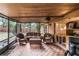 Spacious screened porch with wicker furniture and backyard access at 1309 Paradise Ln, Winter Park, FL 32792