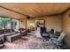 Comfortable screened porch with wicker furniture and backyard access at 1309 Paradise Ln, Winter Park, FL 32792