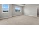 Bright bedroom with carpeted floor and two windows at 1496 Broad Wing Ln, Winter Park, FL 32792