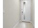 Modern entryway with a white door and tile flooring at 1496 Broad Wing Ln, Winter Park, FL 32792