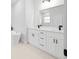 Modern bathroom with double vanity, white cabinets, and freestanding tub at 15410 Sw 23Rd Court R, Ocala, FL 34473