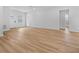 Open living space with light wood flooring, access to front entrance at 15410 Sw 23Rd Court R, Ocala, FL 34473