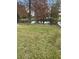 Backyard with pond and lush trees at 1801 Hage Way, Orlando, FL 32805