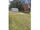 Backyard view of shed and grassy area at 1801 Hage Way, Orlando, FL 32805