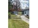Landscaped backyard with storage shed and walkway at 1801 Hage Way, Orlando, FL 32805