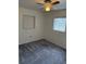 Bedroom with grey carpeting and built-in shelving at 1801 Hage Way, Orlando, FL 32805