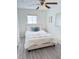 Clean bedroom with a ceiling fan, light gray floors, and natural light at 1801 Hage Way, Orlando, FL 32805