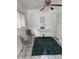 Inviting bedroom area with tile, gray chairs and natural lighting at 1801 Hage Way, Orlando, FL 32805