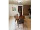 Dining room with dark wood table, stylish chairs, and tile flooring at 1801 Hage Way, Orlando, FL 32805