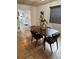 Dining room with dark wood table, stylish chairs, and tile flooring at 1801 Hage Way, Orlando, FL 32805