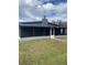 House exterior showcasing a screened porch and yard at 1801 Hage Way, Orlando, FL 32805