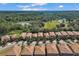 Aerial view of houses and a large green area at 1913 Nice Ct, Kissimmee, FL 34747