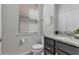Simple bathroom with toilet, sink, and small vanity at 1913 Nice Ct, Kissimmee, FL 34747
