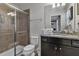 Bathroom with shower, toilet, vanity with granite countertop at 1913 Nice Ct, Kissimmee, FL 34747