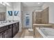 Luxurious bathroom with soaking tub and walk-in shower at 1913 Nice Ct, Kissimmee, FL 34747