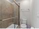 Clean bathroom with shower stall, toilet and tiled walls at 1913 Nice Ct, Kissimmee, FL 34747