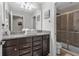 Clean bathroom with granite countertop and walk-in shower at 1913 Nice Ct, Kissimmee, FL 34747