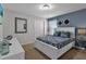 Spacious bedroom with a king-size bed and en-suite bathroom at 1913 Nice Ct, Kissimmee, FL 34747
