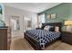 Main bedroom with king-size bed and access to bathroom at 1913 Nice Ct, Kissimmee, FL 34747