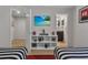 Bedroom with twin beds, TV, and adjacent bathroom at 1913 Nice Ct, Kissimmee, FL 34747