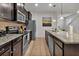 Modern kitchen with dark wood cabinets and granite countertops at 1913 Nice Ct, Kissimmee, FL 34747