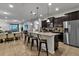 Open kitchen with an island, stainless steel appliances and breakfast bar at 1913 Nice Ct, Kissimmee, FL 34747