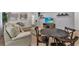 Cozy living room with seating area and a small dining table at 1913 Nice Ct, Kissimmee, FL 34747