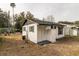 Newly remodeled small house with white exterior and dark trim at 1913 Nw 12Th St, Ocala, FL 34475