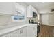 Modern white kitchen with stainless steel appliances and quartz countertops at 1913 Nw 12Th St, Ocala, FL 34475