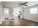Open living area with kitchen, hardwood floors, and ceiling fan at 1913 Nw 12Th St, Ocala, FL 34475