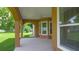 Covered back patio with ceiling fan, overlooking the lush backyard, perfect for outdoor relaxation at 1943 Sipes Ave, Sanford, FL 32771