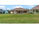 Spacious backyard with large tan house at 1943 Sipes Ave, Sanford, FL 32771