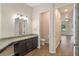 Bathroom with single vanity, toilet, and access to bedroom at 1943 Sipes Ave, Sanford, FL 32771