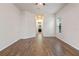 Spacious bedroom with wood-look floors and access to a bathroom at 1943 Sipes Ave, Sanford, FL 32771