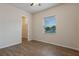 Well-lit bedroom with wood-look floors and a walk-in closet at 1943 Sipes Ave, Sanford, FL 32771