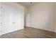 Simple bedroom with wood-look floors and double door closet at 1943 Sipes Ave, Sanford, FL 32771