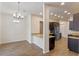 Modern kitchen featuring dark cabinetry and granite countertops at 1943 Sipes Ave, Sanford, FL 32771